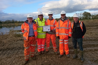 Photo showing AI and Yorkshire Wildlife Trust team with their biodiversity benchmark certificate 