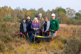 Volunteers posing with equipment