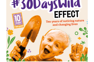30 Days Wild poster, featuring smiling child holding a trowel. 