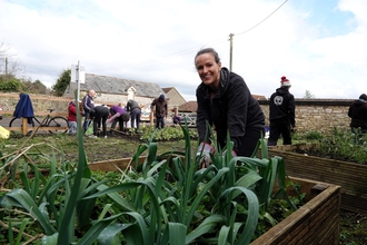 Volunteer gardening in a raised bed