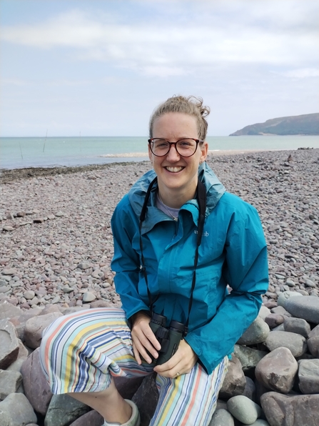 Vanessa Lloyd sat on the rocks at the beach