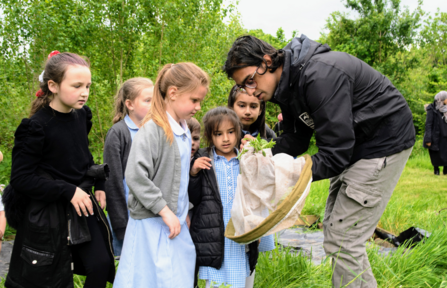 Aaron Bhambra, a Natural Prospects Trainee with Birmingham and Black Country Wildlife Trust, engaging with school group