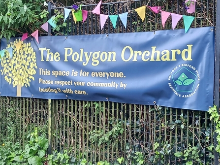 A sign reading 'The Polygon Orchard' 