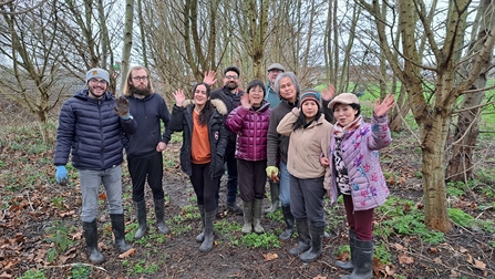 Group of people in woodlands in the winter. 